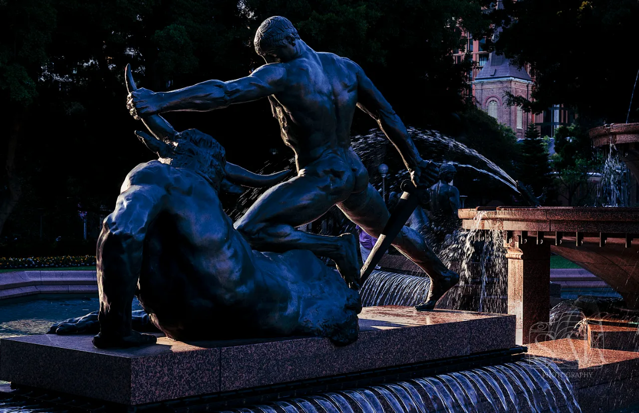 Bronze sculpture lit at night